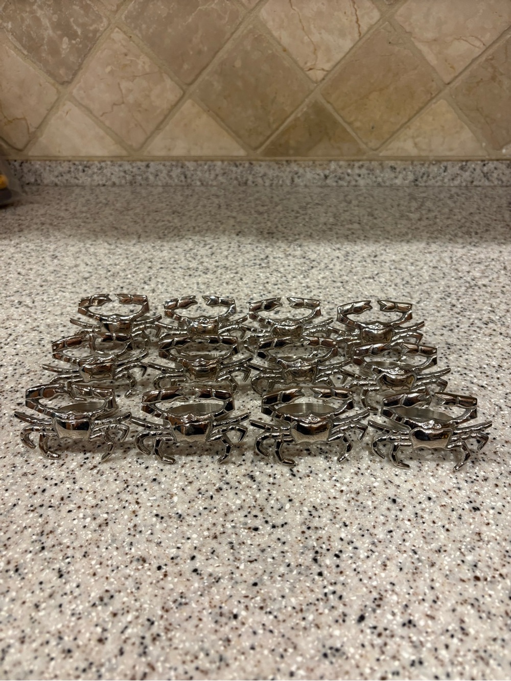 Silver-tone metal crab napkin rings. Lot Of 12